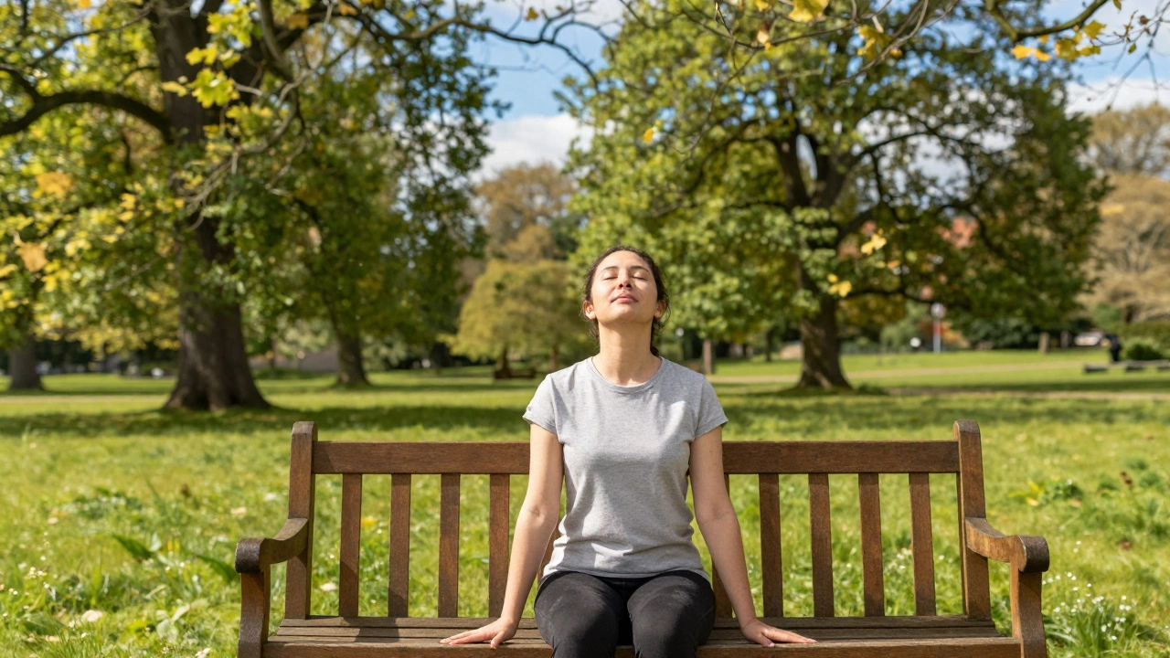 Person sitting peacefully on a park bench practicing grounding and mindfulness